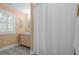Bathroom features a vanity with storage and a shower with a curtain at 478 Commonwealth Rd, Mount Pleasant, SC 29466