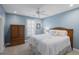 Charming bedroom with blue walls, a wood-frame bed, and plantation shutters at 478 Commonwealth Rd, Mount Pleasant, SC 29466