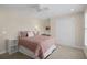 Comfortable bedroom with a pink quilt and double-door closet at 478 Commonwealth Rd, Mount Pleasant, SC 29466
