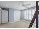 Bright bedroom with a ceiling fan, window with shutters, neutral carpet and light blue walls at 478 Commonwealth Rd, Mount Pleasant, SC 29466