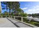 A large deck overlooking a river with railings, trees and dock views at 478 Commonwealth Rd, Mount Pleasant, SC 29466