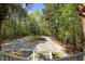 Long winding driveway leading to a beautiful home, surrounded by lush greenery at 478 Commonwealth Rd, Mount Pleasant, SC 29466