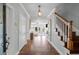Elegant foyer with hardwood floors, staircase, and a glimpse into the bright, open living space at 478 Commonwealth Rd, Mount Pleasant, SC 29466