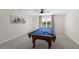Bright game room featuring a pool table, ceiling fan, and neutral carpet at 478 Commonwealth Rd, Mount Pleasant, SC 29466