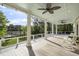 Expansive covered porch with scenic river views, rocking chairs, and ceiling fans at 478 Commonwealth Rd, Mount Pleasant, SC 29466