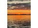 Beautiful sunset over the water reflecting gold and red, creating a peaceful and captivating scene at 478 Commonwealth Rd, Mount Pleasant, SC 29466