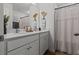 Bathroom with a double sink vanity, a shower curtain, and tasteful decorations at 484 Trotters Ln, Moncks Corner, SC 29461