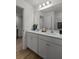 Modern bathroom with double vanity, white cabinets, and neutral decor at 484 Trotters Ln, Moncks Corner, SC 29461