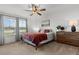 Cozy bedroom features a ceiling fan and natural light from the windows at 484 Trotters Ln, Moncks Corner, SC 29461