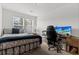 Bedroom with cozy bed, large windows, desk, and modern computer setup at 484 Trotters Ln, Moncks Corner, SC 29461
