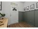 Bright entryway with white walls, wood-look floors, and decorative accents at 484 Trotters Ln, Moncks Corner, SC 29461