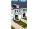 Charming townhome exterior with modern gray siding, well-maintained landscaping, and attached one-car garage at 484 Trotters Ln, Moncks Corner, SC 29461