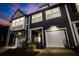 Charming townhome with a well-lit entrance and an attached garage at 484 Trotters Ln, Moncks Corner, SC 29461
