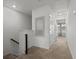 Upstairs hallway with neutral carpet and white doors provides access to bedrooms at 484 Trotters Ln, Moncks Corner, SC 29461