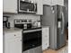Well-equipped kitchen features stainless steel appliances, granite countertops, and white cabinets at 484 Trotters Ln, Moncks Corner, SC 29461