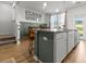 Spacious kitchen island with seating, pendant lighting, and modern finishes at 484 Trotters Ln, Moncks Corner, SC 29461