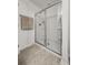 Frameless glass walk-in shower with built-in shelving and a towel bar at 484 Trotters Ln, Moncks Corner, SC 29461