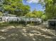 Spacious backyard featuring a large wooden deck and lush landscape at 4869 Slans Island Rd, Hollywood, SC 29449