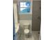 Bathroom featuring an elegant marble vanity, marble floors and wainscotting, and modern shower at 4869 Slans Island Rd, Hollywood, SC 29449