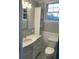 Bathroom featuring an elegant marble vanity, marble floors and wainscotting at 4869 Slans Island Rd, Hollywood, SC 29449