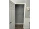 Bedroom closet featuring shelving and wainscotting at 4869 Slans Island Rd, Hollywood, SC 29449