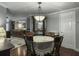 Charming dining area with a traditional table set, chandelier, and kitchen access at 4869 Slans Island Rd, Hollywood, SC 29449