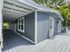 Exterior showcasing an expansive porch area, perfect for outdoor living and enjoying the surrounding scenery at 4869 Slans Island Rd, Hollywood, SC 29449