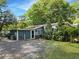 The rear exterior reveals a home design with an exterior door with a small covered porch at 4869 Slans Island Rd, Hollywood, SC 29449