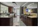 Well-lit kitchen featuring granite counters, stainless appliances, and backyard access at 4869 Slans Island Rd, Hollywood, SC 29449