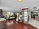 Spacious living room featuring a fireplace, hardwood floors, and abundant natural light at 4869 Slans Island Rd, Hollywood, SC 29449