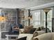 Inviting living room with stone fireplace, wood stove and comfortable seating perfect for cozy evenings at 4869 Slans Island Rd, Hollywood, SC 29449