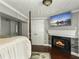 Elegant main bedroom with a fireplace and mounted TV, blending relaxation and entertainment in a stylish setting at 4869 Slans Island Rd, Hollywood, SC 29449