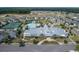 Aerial view of community amenities: pool, tennis courts, clubhouse, and well-manicured landscaping at 5049 Song Sparrow Way, Summerville, SC 29483