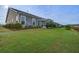 Expansive backyard with manicured lawn and patio perfect for outdoor activities at 5049 Song Sparrow Way, Summerville, SC 29483
