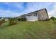 Spacious backyard featuring a well-maintained lawn, fenced perimeter, and lush landscaping at 5049 Song Sparrow Way, Summerville, SC 29483