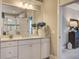 Bathroom with double sink vanity, granite counters, white cabinetry, and walk-in shower at 5049 Song Sparrow Way, Summerville, SC 29483