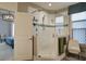 Bathroom featuring a glass-enclosed shower, neutral tones, and a view into the bedroom at 5049 Song Sparrow Way, Summerville, SC 29483