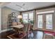 Bright dining area with modern decor, a stylish light fixture, and a view of the outdoor patio through glass doors at 5049 Song Sparrow Way, Summerville, SC 29483