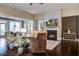 Cozy living room with a warm fireplace, hardwood floors, and comfortable seating, perfect for relaxation at 5049 Song Sparrow Way, Summerville, SC 29483