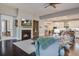 Elegant living room featuring a fireplace with a TV, hardwood floors, and a comfortable seating area at 5049 Song Sparrow Way, Summerville, SC 29483