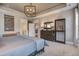 Comfortable main bedroom features a king bed, carpet, neutral walls, decorative lighting, and furnishings at 5049 Song Sparrow Way, Summerville, SC 29483