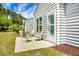 Cozy back patio area with an outdoor seating set perfect for entertaining guests at 505 Eastern Isle Ave, Summerville, SC 29486