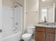Well-lit bathroom featuring a shower-tub combination and a vanity with granite countertop at 505 Eastern Isle Ave, Summerville, SC 29486