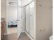 Bathroom featuring a glass door shower and a glimpse into an adjacent bedroom at 505 Eastern Isle Ave, Summerville, SC 29486