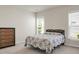 Bright bedroom featuring neutral walls, large window, and a patterned comforter at 505 Eastern Isle Ave, Summerville, SC 29486