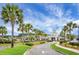 Stately community clubhouse surrounded by palm trees and meticulously landscaped grounds at 505 Eastern Isle Ave, Summerville, SC 29486