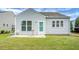 Rear exterior of home with a charming patio area and well-maintained yard at 505 Eastern Isle Ave, Summerville, SC 29486