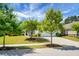 Attractive home with green lawn, tree-lined street and long driveway leading to the attached garage at 505 Eastern Isle Ave, Summerville, SC 29486