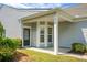 Inviting covered front porch featuring a bay window and a neatly maintained lawn at 505 Eastern Isle Ave, Summerville, SC 29486