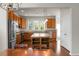 An open kitchen with wood cabinets, stainless steel appliances, an island, and granite countertops at 505 Eastern Isle Ave, Summerville, SC 29486